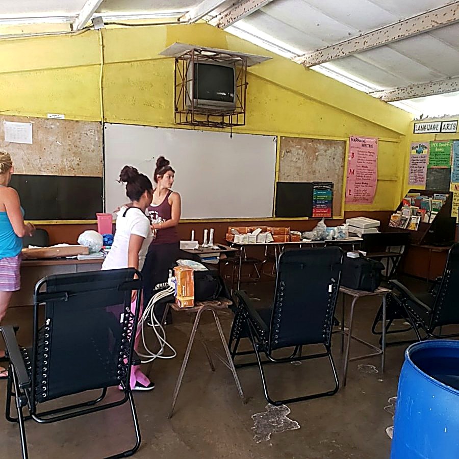 Volunteers setting up the classroom clinic before patients arrived