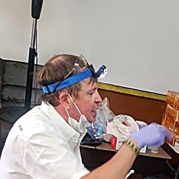 Dr. Will and assistants at work during a clinic day