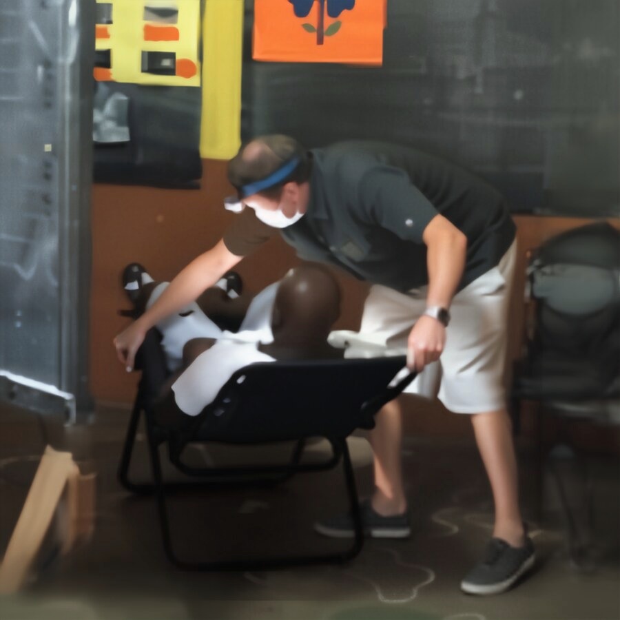 Dr. Will treating a patient in a folding chair
