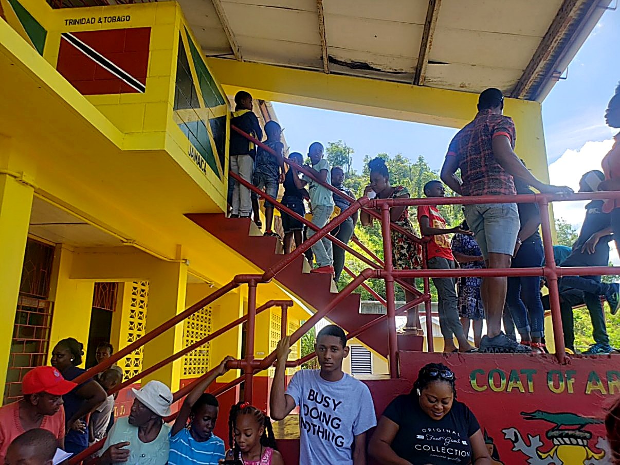 Families lined up on the school stairs, waiting to be seen