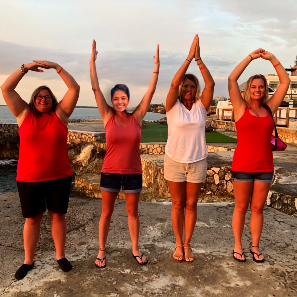 The team spelling out OHIO at sunset on the Jamaican coast